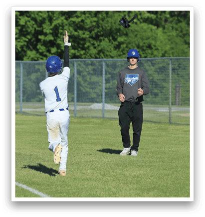 A man wearing a blue hat and a white shirt is throwing a baseball. Description generated by AI