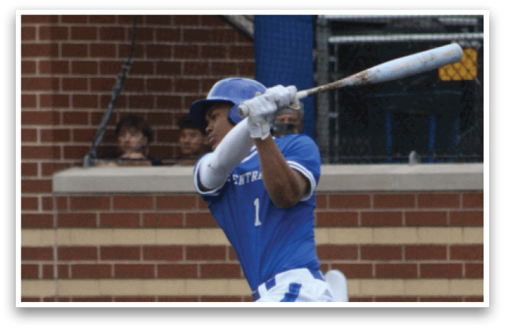 A baseball player in a blue and white uniform is swinging a bat. Description generated by AI