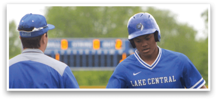 Two men wearing blue and white uniforms. Description generated by AI