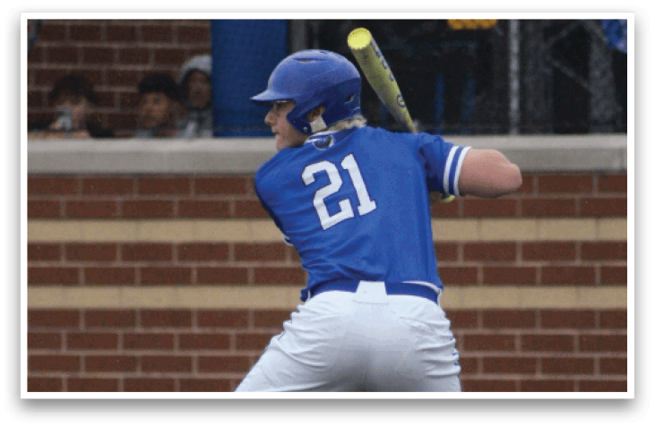 A baseball player in a blue shirt and white pants is swinging a bat at a ball. Description generated by AI