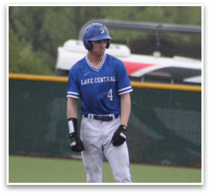 A baseball player wearing a blue shirt and white pants. Description generated by AI