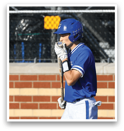 A baseball player wearing a blue and white uniform. Description generated by AI
