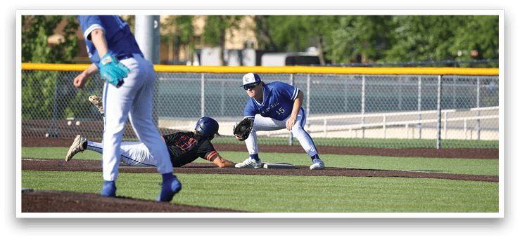 A baseball player slides into a base. Description generated by AI