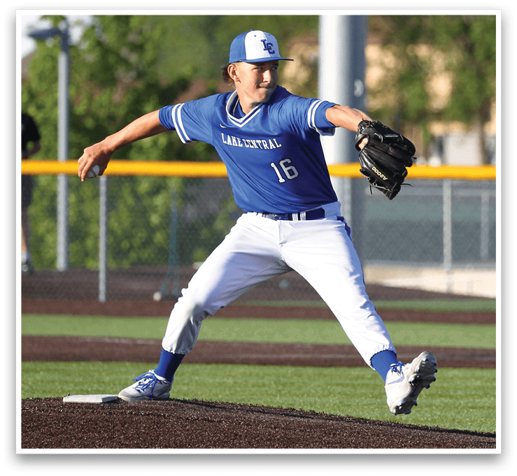 A baseball player in a blue uniform is pitching a ball. Description generated by AI