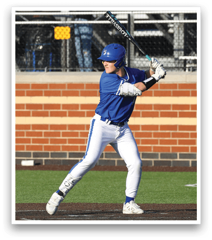 A baseball player in a blue and white uniform is swinging a bat. Description generated by AI