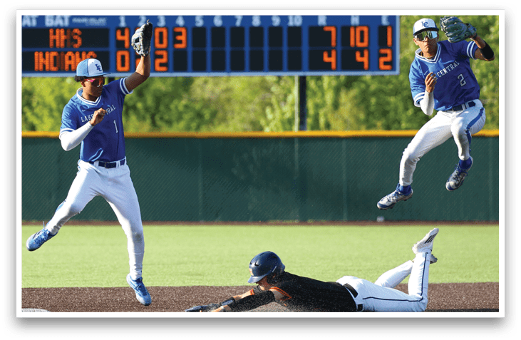 A baseball player sliding into a base. Description generated by AI