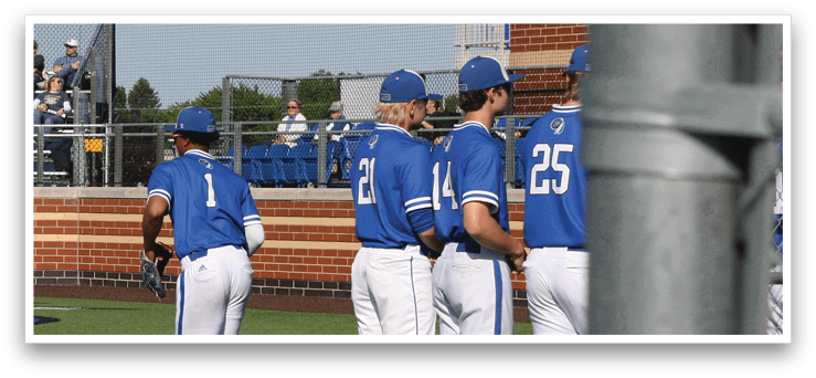 Baseball players standing on a field. Description generated by AI