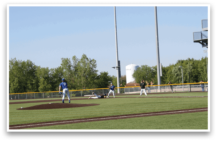 A baseball game is taking place on a field. Description generated by AI