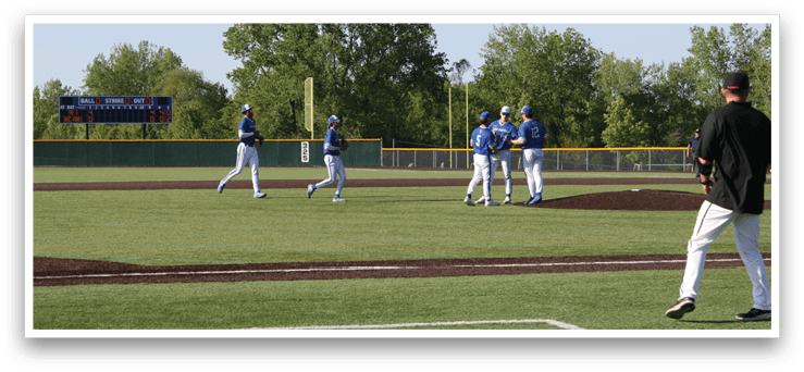 A group of baseball players on a field. Description generated by AI