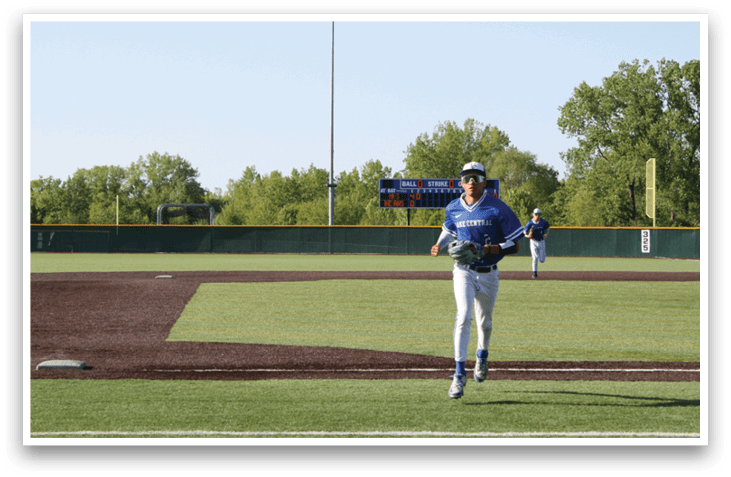 A baseball player is running on the field. Description generated by AI