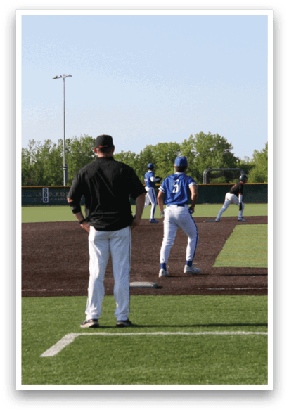 A baseball game is taking place on a field. Description generated by AI