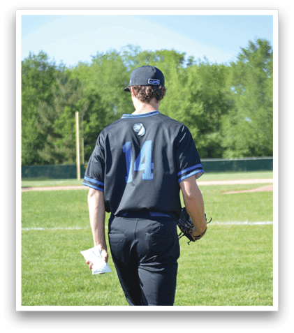 A man wearing a black shirt with the number 14 on it. Description generated by AI
