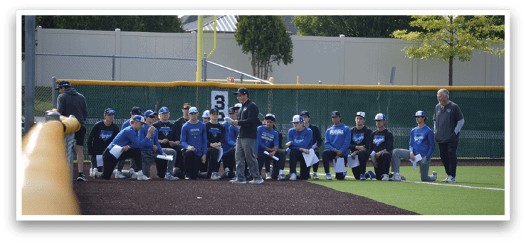 A group of people are sitting on the baseball field. Description generated by AI