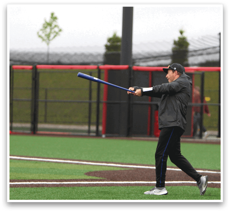 A man is swinging a baseball bat at a ball. Description generated by AI