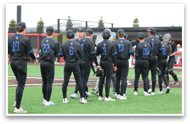 A group of baseball players wearing black jerseys with blue numbers and letters. Description generated by AI