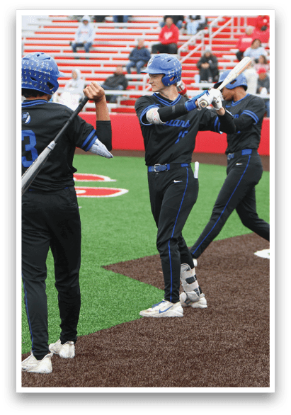 Baseball players on a field. Description generated by AI