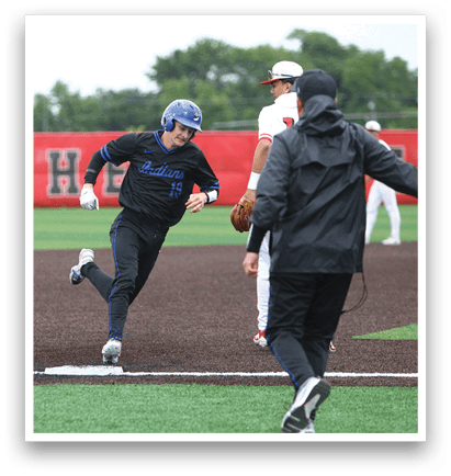 A baseball player running to a base. Description generated by AI