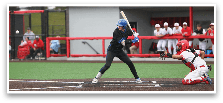 A baseball player in a blue helmet and black shirt is swinging a bat. Description generated by AI