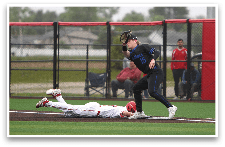 A baseball player slides into home plate. Description generated by AI