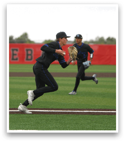 A baseball player in a blue uniform catching a ball. Description generated by AI
