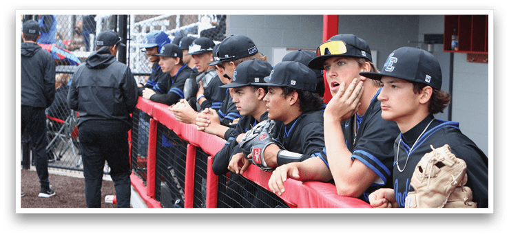 A group of baseball players sitting on a bench. Description generated by AI