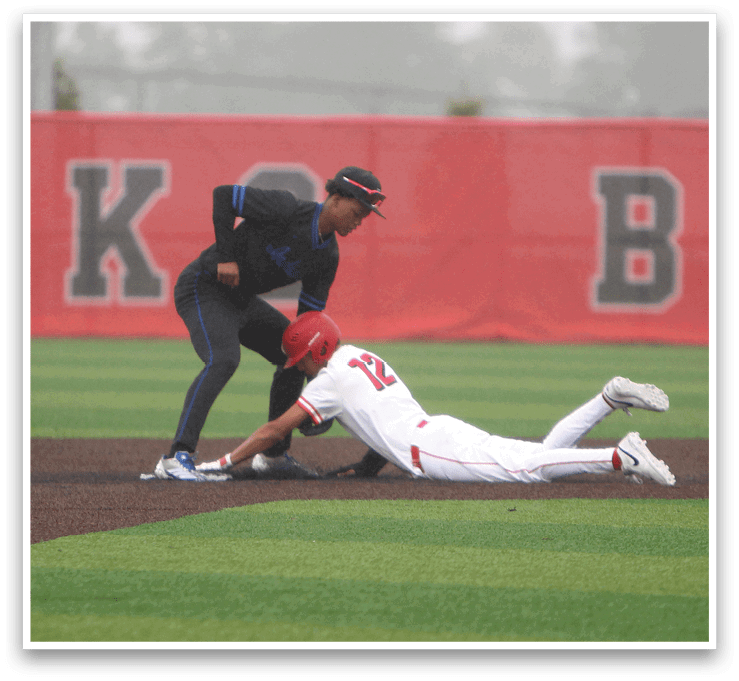 A baseball player slides into a base. Description generated by AI