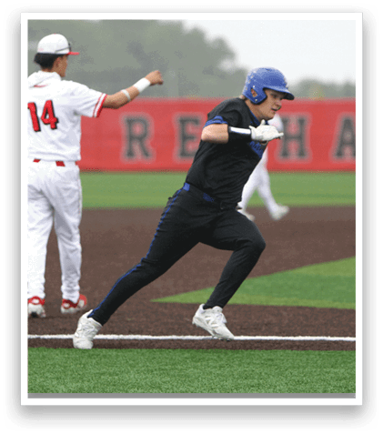 A baseball player wearing a blue and black uniform is running to a base. Description generated by AI