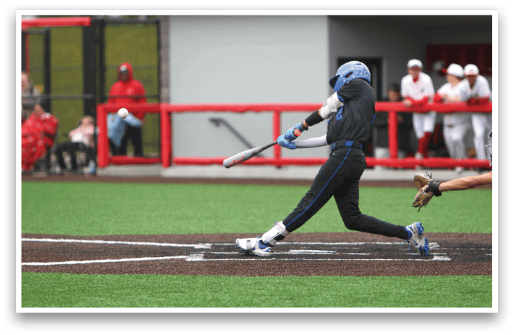 A baseball player is swinging a bat at a ball. Description generated by AI