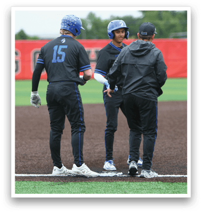 Three baseball players wearing black uniforms and blue helmets. Description generated by AI