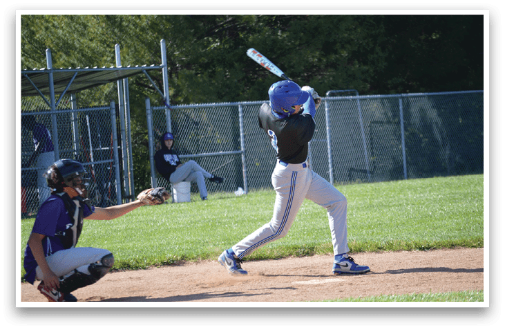 A baseball player in a blue helmet is swinging a bat. Description generated by AI