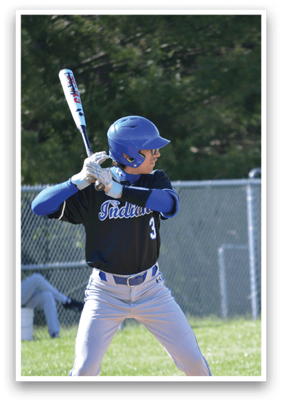A baseball player in a blue helmet and black shirt is holding a bat and preparing to swing. Description generated by AI