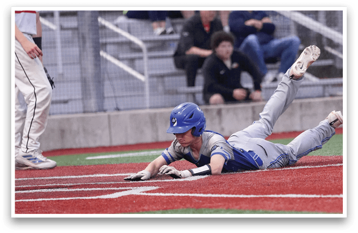 A baseball player slides into a base. Description generated by AI