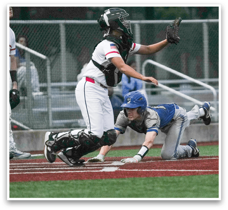 A baseball player slides into home plate. Description generated by AI