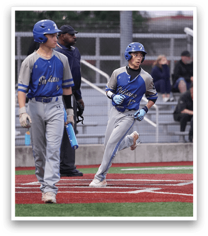 Two baseball players on a field. Description generated by AI