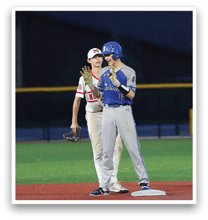 Two baseball players on a field. Description generated by AI