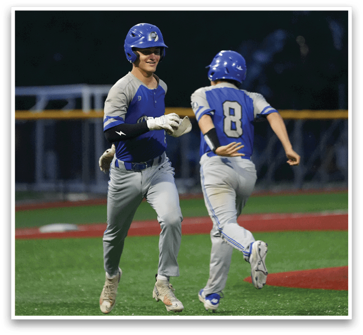 Two baseball players running on the field. Description generated by AI