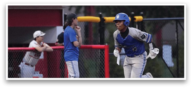A baseball player running to a base. Description generated by AI