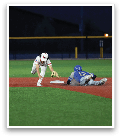 A baseball player slides into home base. Description generated by AI
