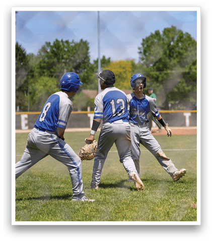 A group of baseball players on a field. Description generated by AI