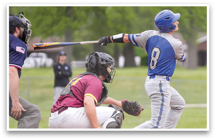 A baseball player is swinging a bat at a ball. Description generated by AI