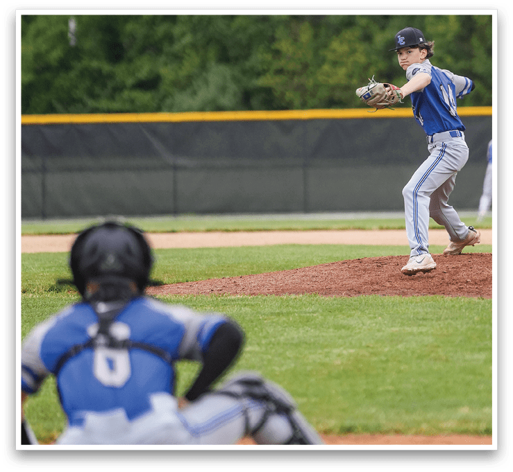 A baseball player is pitching a ball. Description generated by AI