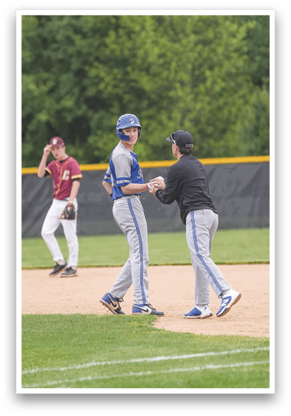 A baseball player wearing a blue helmet. Description generated by AI