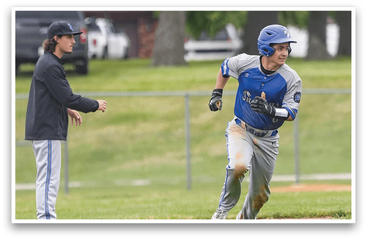 A baseball player running on the field. Description generated by AI