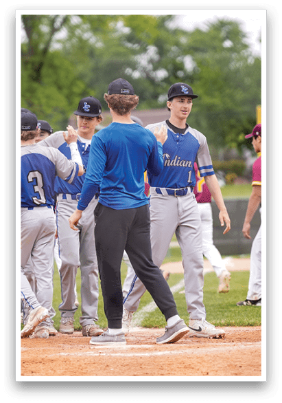 A group of baseball players on a field. Description generated by AI