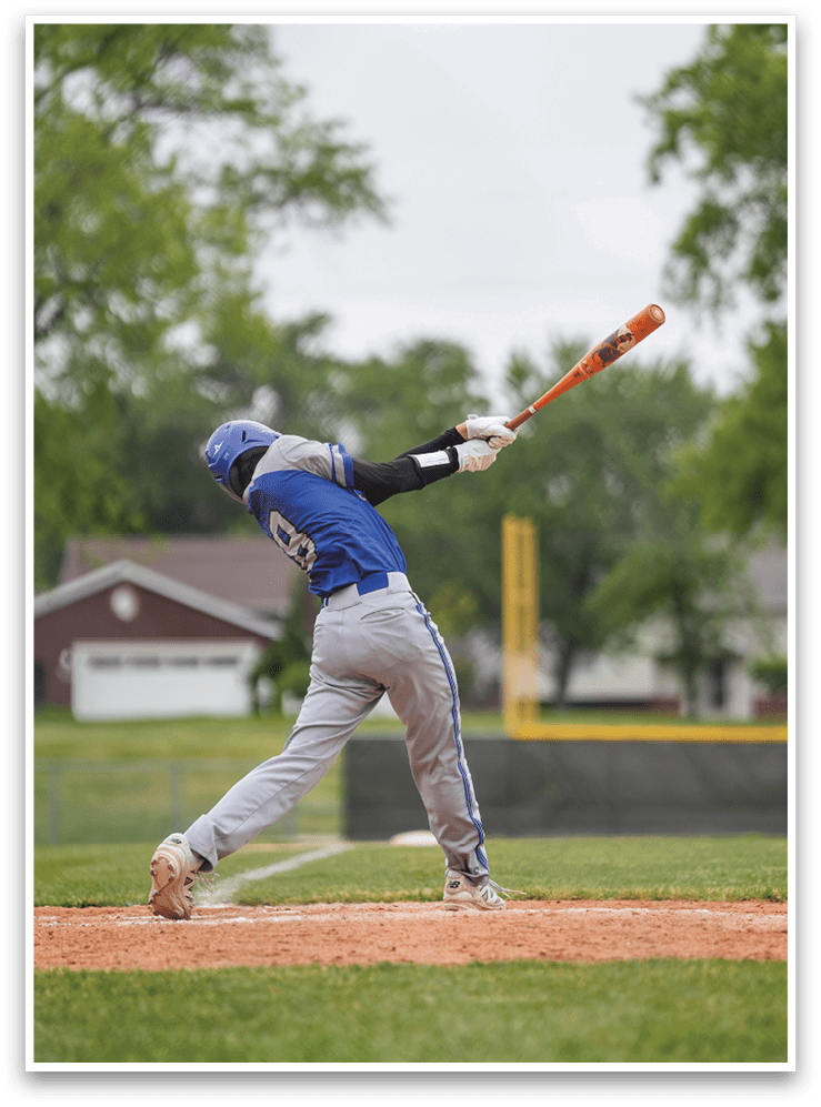 A baseball player is swinging a bat. Description generated by AI