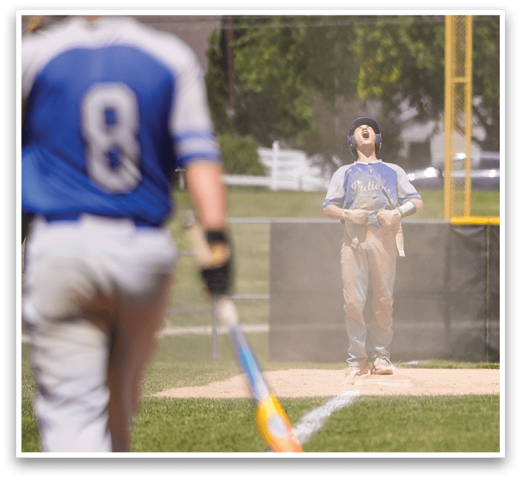 A baseball player holding a bat. Description generated by AI