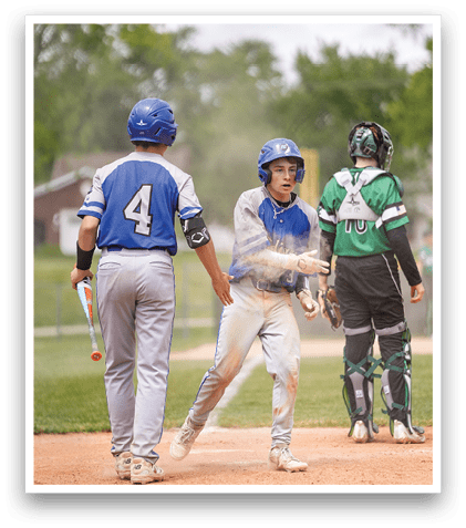 A baseball player is sliding into home plate. Description generated by AI