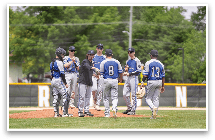 A group of baseball players on a field. Description generated by AI