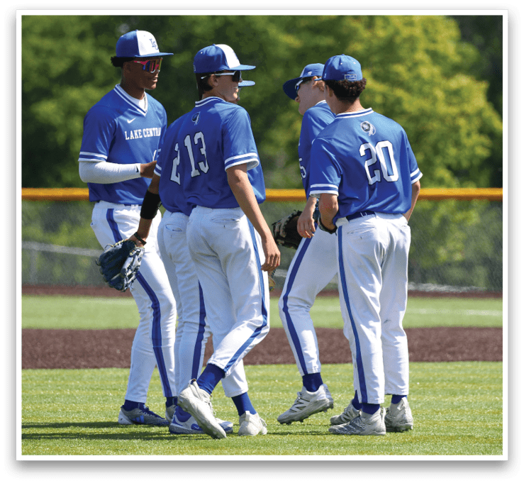 Three baseball players wearing blue and white uniforms. Description generated by AI
