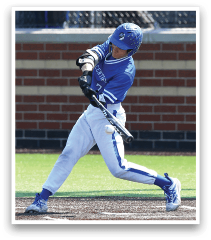 A baseball player in a blue and white uniform is swinging a bat. Description generated by AI